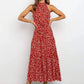 Red polka dot halter neck sleeveless tiered swing maxi dress worn by a model