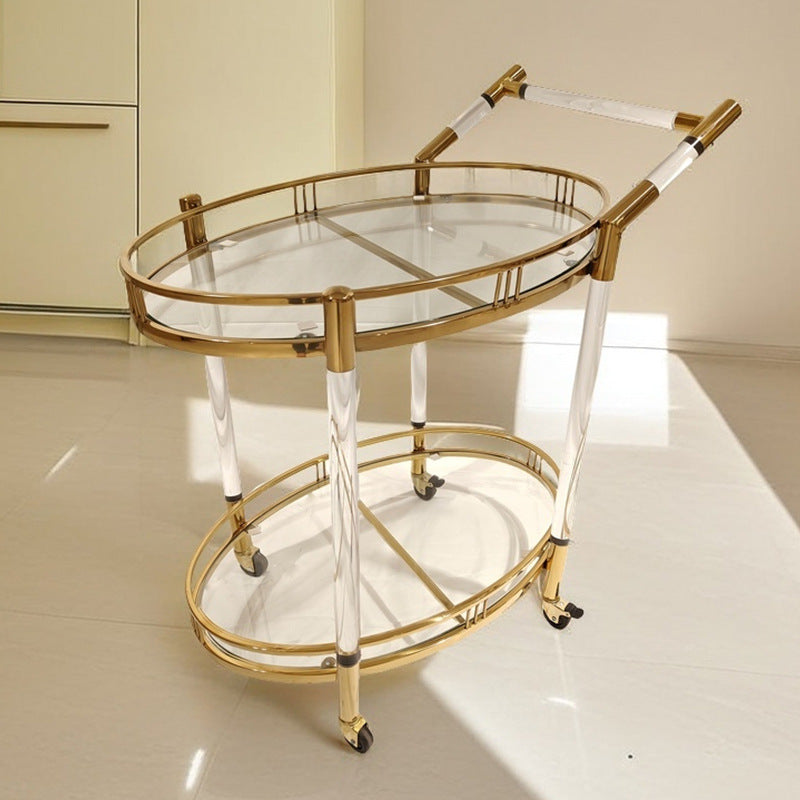 Gold serving cart lower glass shelf with bar tools shown from the side