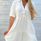 Black short sleeve cotton and linen tiered shirt dress front view with short sleeves and a mid length hem