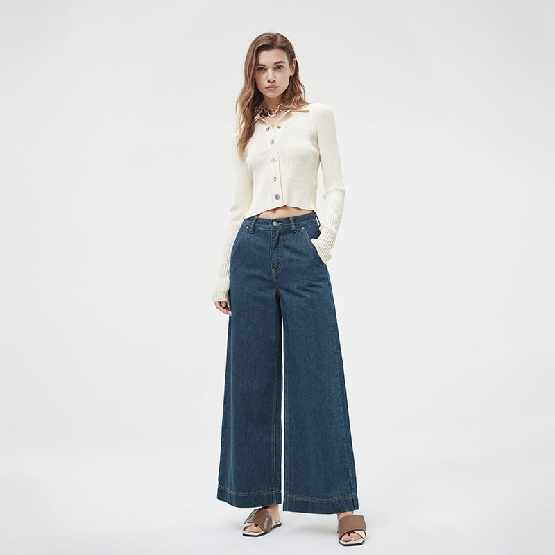 Close-up of brass rivets and button fly on retro flared jeans