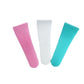 Close view of the ridged grip end of the white PP plastic cream scraper
