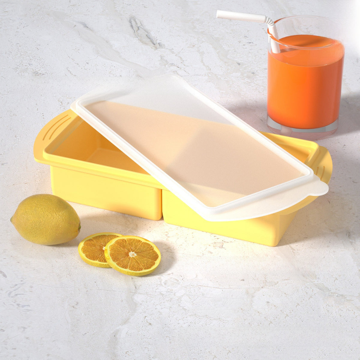 Flexible platinum silicone ice cube tray with the lid lifted off for frozen broth and baby food