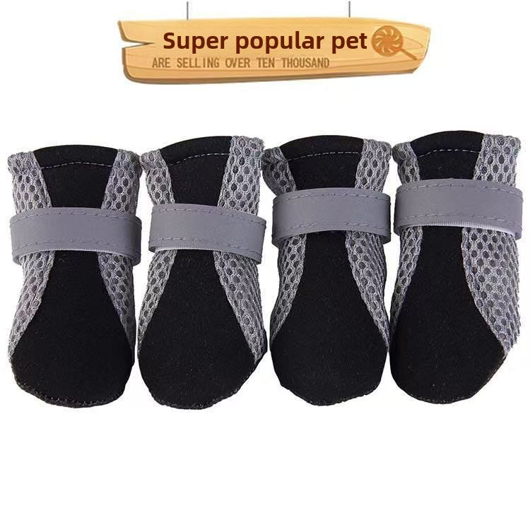 Set of four mesh dog shoes with black padded toe and grey reflective strap across the top