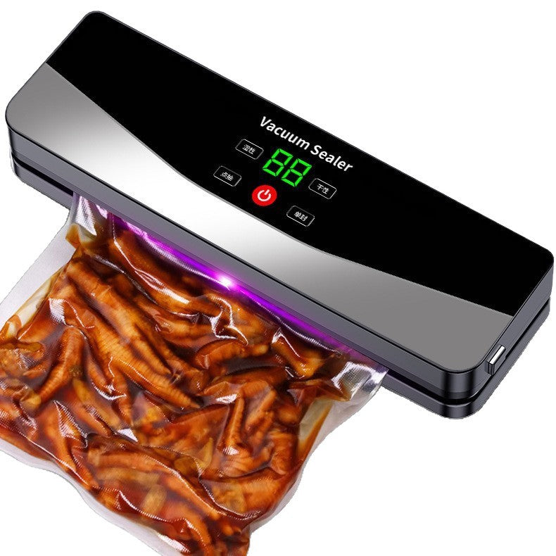 Close view of the vacuum sealer heat sealing a bag of marinated food with the digital display lit