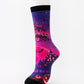 Mid-calf sock on a mannequin printed in pink and purple with Trick or Treat lettering and a castle
