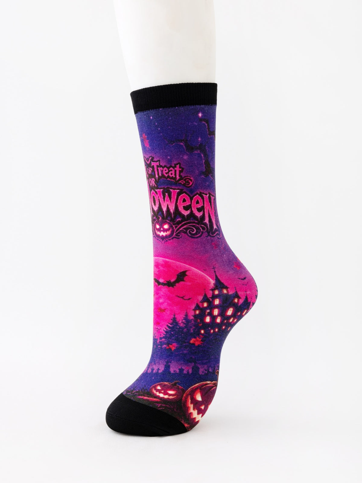Mid-calf sock on a mannequin printed in pink and purple with Trick or Treat lettering and a castle