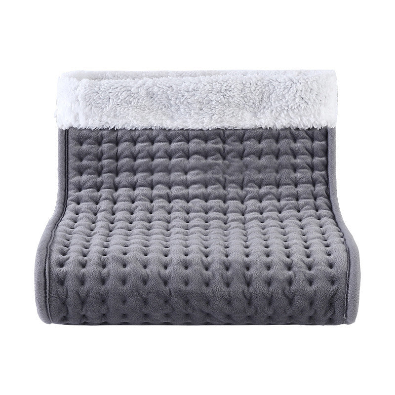 Gray quilted electric foot warmer with a white plush cuff, open boot-shaped pouch seen from the front