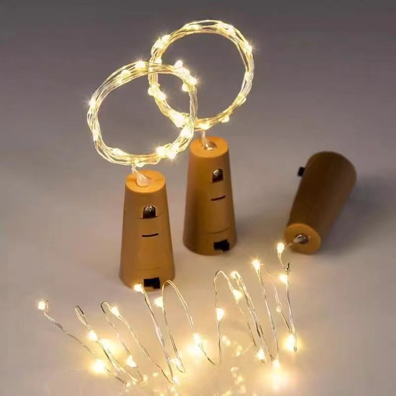 Three cork shaped LED stoppers with warm white copper wire fairy string for empty bottle decoration