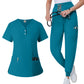 Womens V neck scrub top in mango yellow worn from the front to show the fitted cut