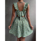 Close view of the ditsy floral print and ruffled shoulder straps on the mini dress