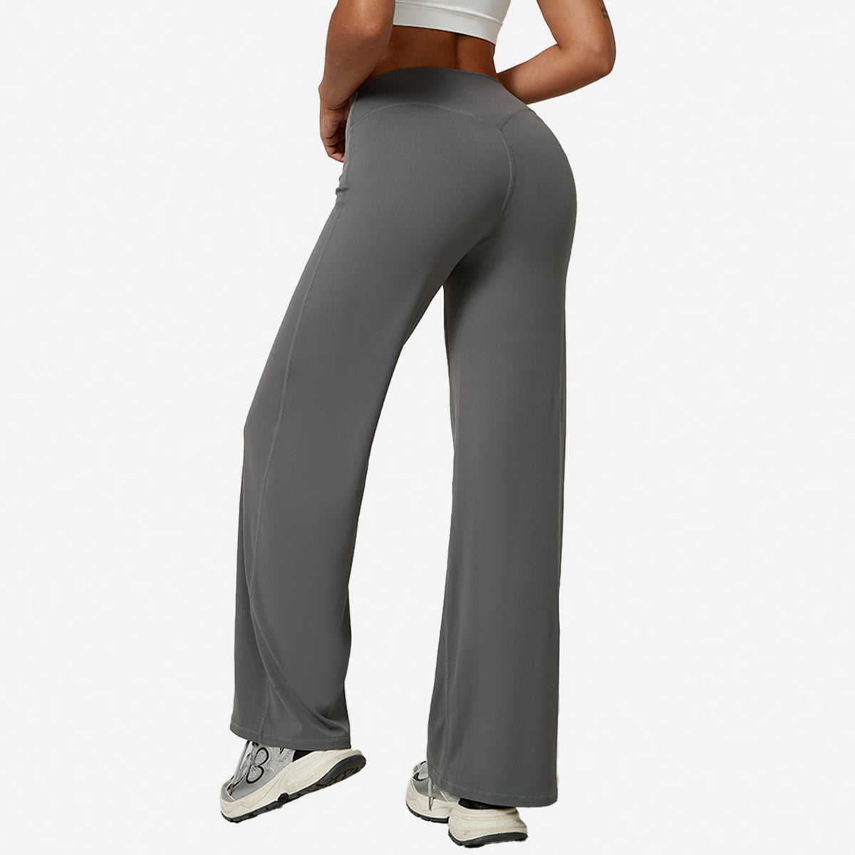Grey high-waist wide-leg flared yoga pants back view showing high waistband, white studio