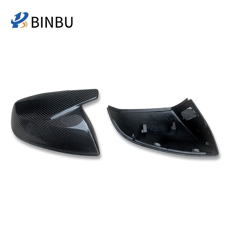 Carbon fiber mirror cover beside its black inner shell with clip tabs, option Ordinary non-porous