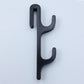 Black resin single sided double hook with two arms stacked, seen from the front on a light background