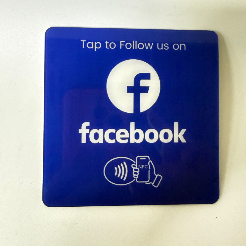 Close up of the printed NFC tap icon and QR code on an acrylic sticker