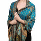 Turquoise paisley tassel shawl wrap worn draped over the shoulders with tasseled fringe ends