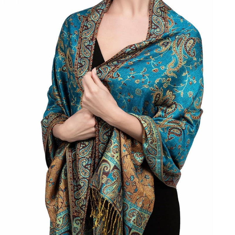 Turquoise paisley tassel shawl wrap worn draped over the shoulders with tasseled fringe ends