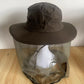 Outdoor sun hat worn with the mesh face net raised and the wide brim shading