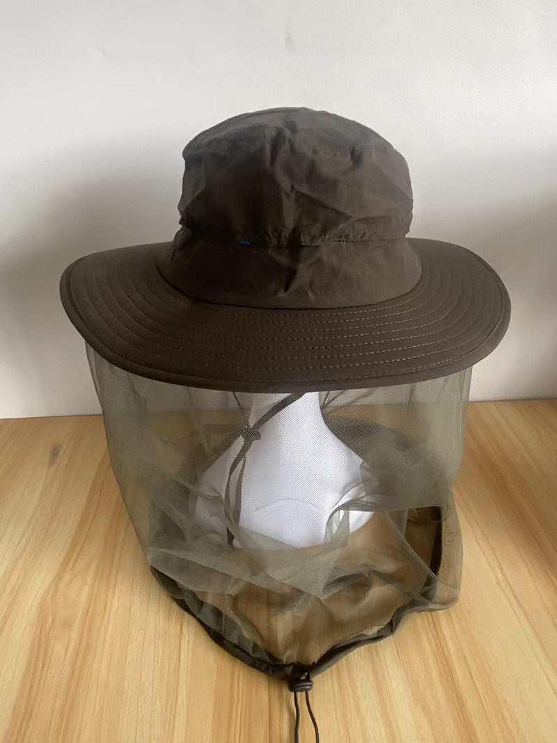 Outdoor sun hat worn with the mesh face net raised and the wide brim shading