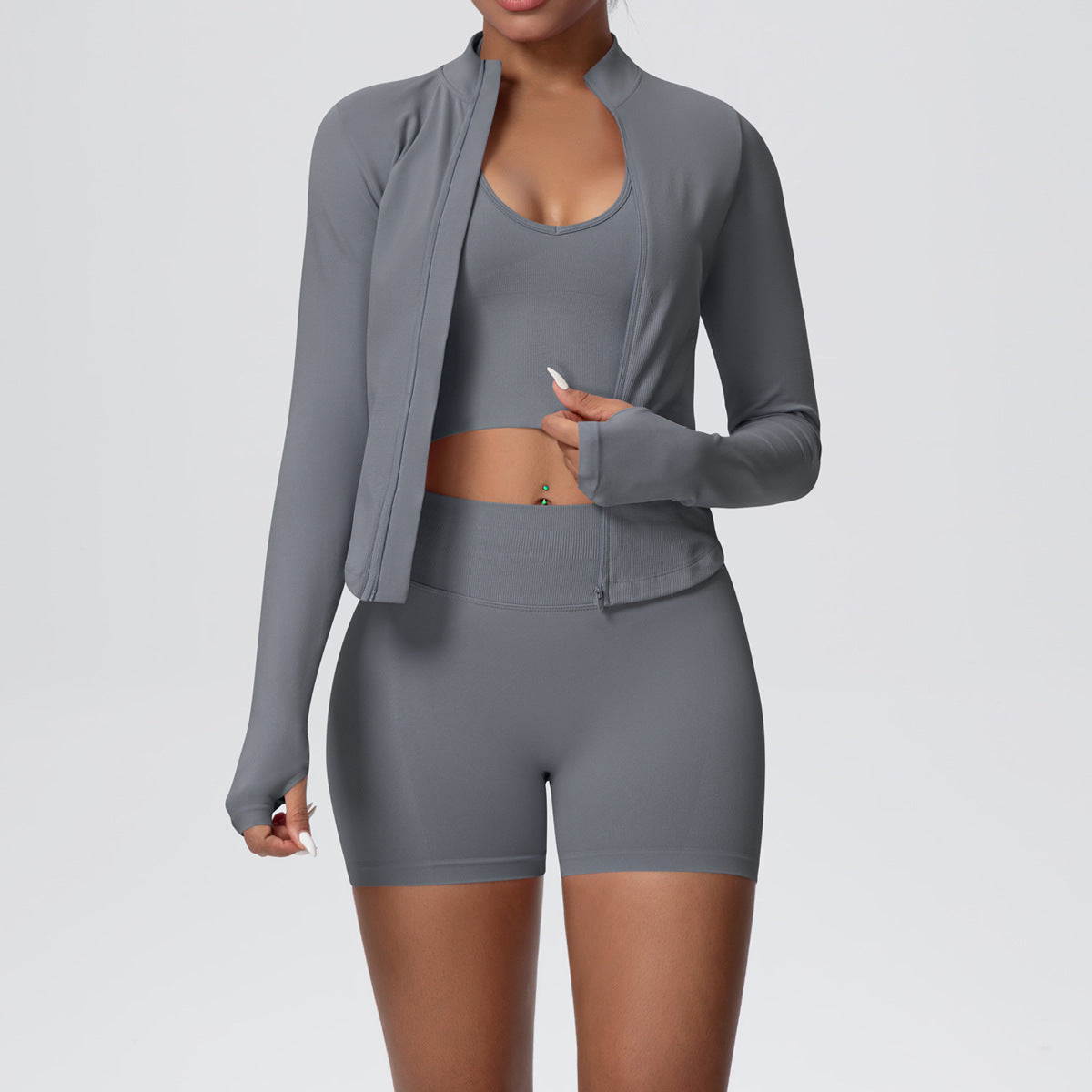 Dark gray seamless yoga set with long sleeve zip jacket, cropped tank and high waist shorts