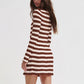 Brown and cream striped ribbed knit dress with long sleeves, model seen from behind