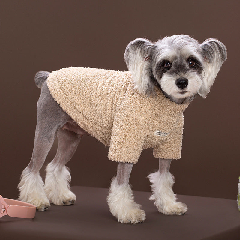 Striped Rainbow Plush fleece dog sweater worn by a small white dog, standing