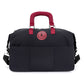 Black duffel travel bag with burgundy padded handles, round patch and front slip pockets, second view