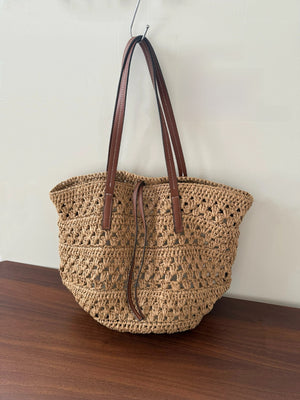 Large Woven Straw Tote Bag | side profile angle shot