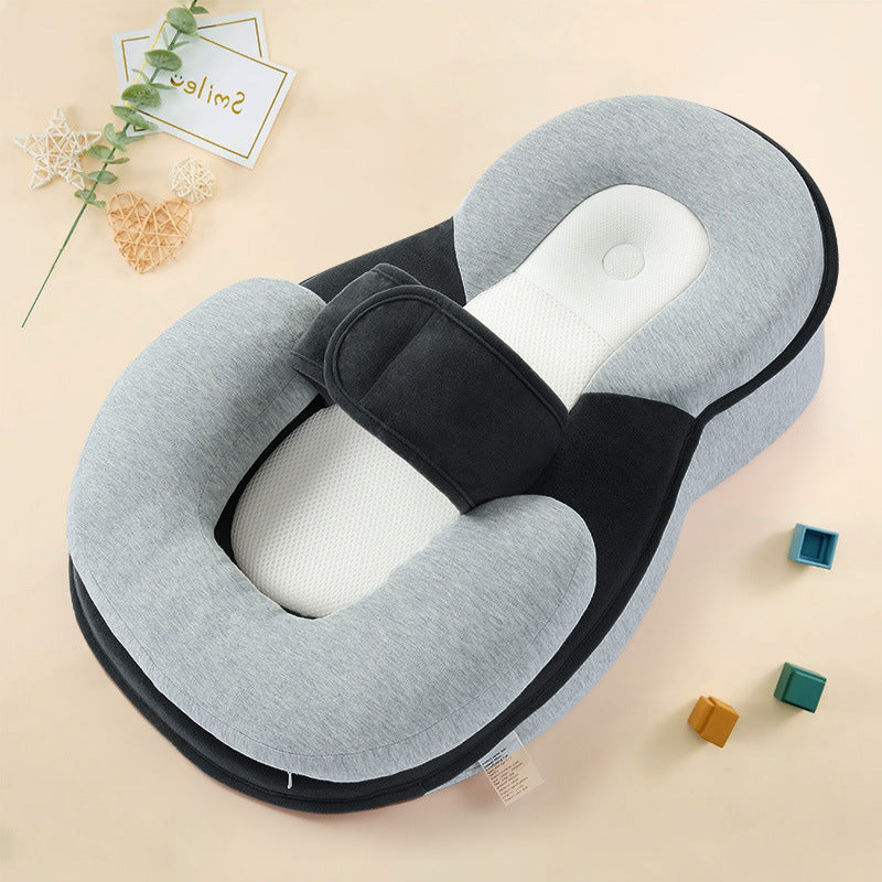 Option Grey: grey wedge lounger pillow with a black panel, white mesh insert and strap on a cream background with blocks