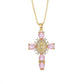 Gold tone cross pendant paved with clear cubic zirconia on a fine plated chain