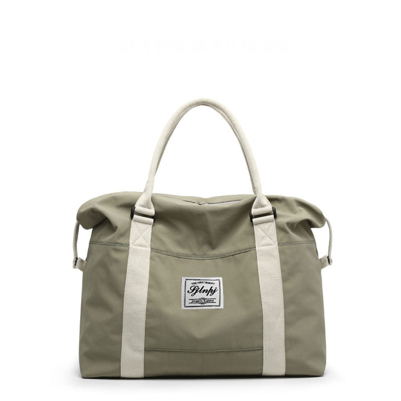 Sage green nylon weekender bag with cream top handles