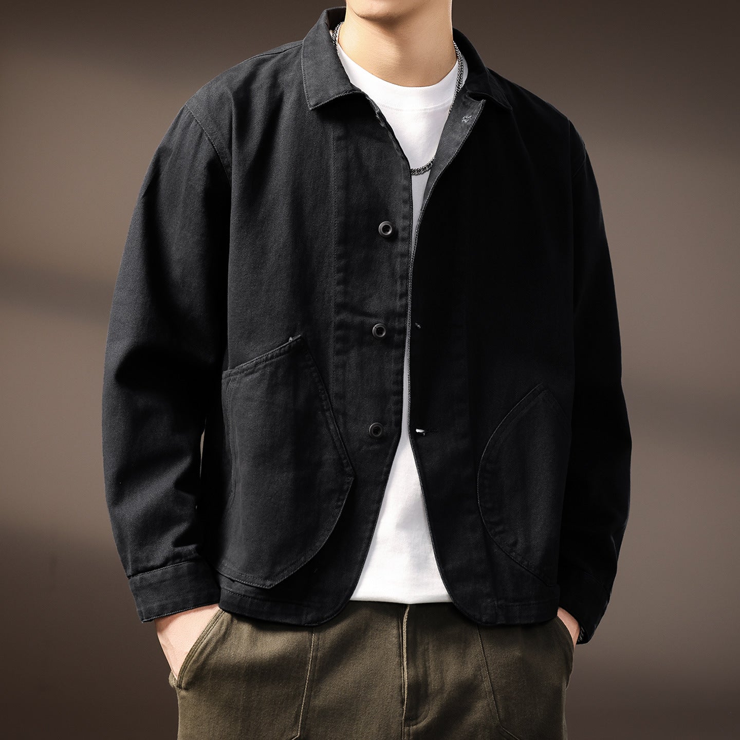 Close-up of the brushed cotton blend fabric and topstitching on the shirt jacket chest pocket