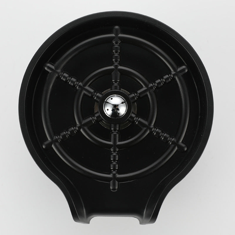 Close view of the black spray head and splash guard ring of the glass rinser
