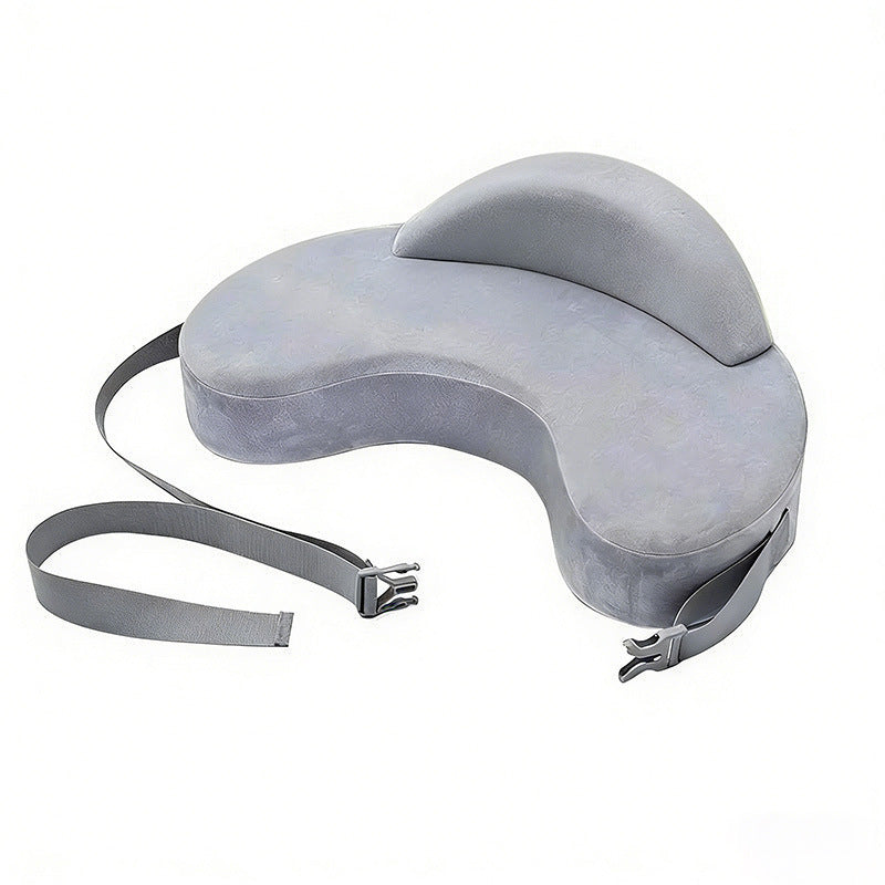 Grey memory foam infant nursing pillow on a soft lit studio surface, full shape