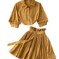 Side view of the short-sleeve shirt and matching skirt showing the waist line