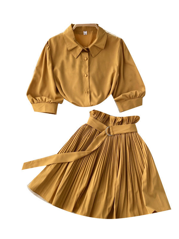 Side view of the short-sleeve shirt and matching skirt showing the waist line