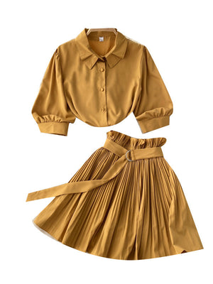 Side view of the short-sleeve shirt and matching skirt showing the waist line