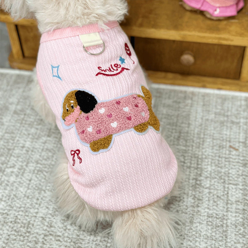 Sleeveless small dog vest with a back leash D-ring and a dachshund applique detail of the D-ring hardware