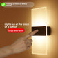 Minimalist LED wall sconce lighting a hallway at night