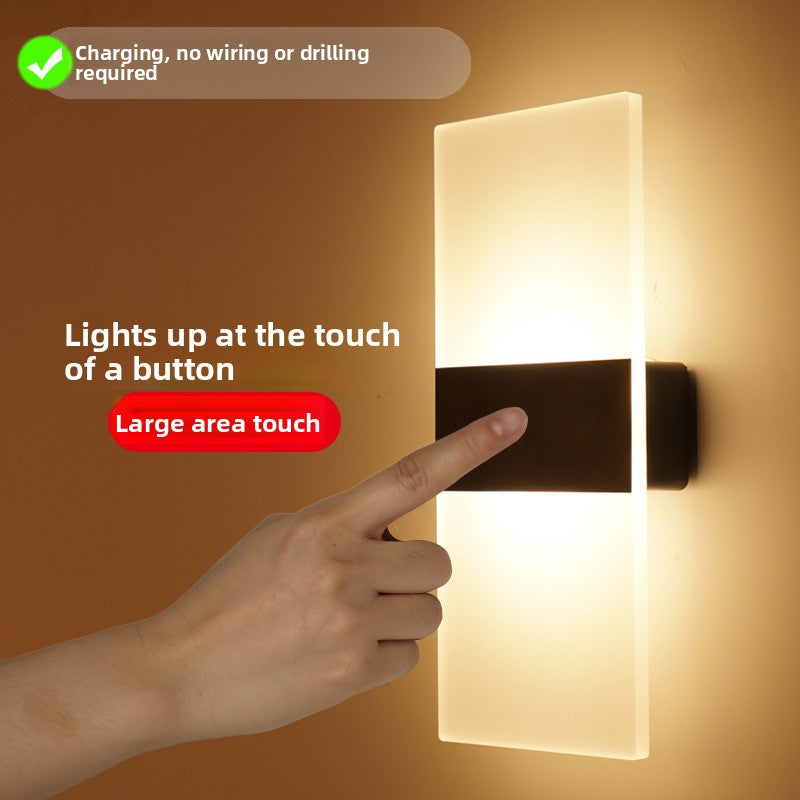 Minimalist LED wall sconce lighting a hallway at night