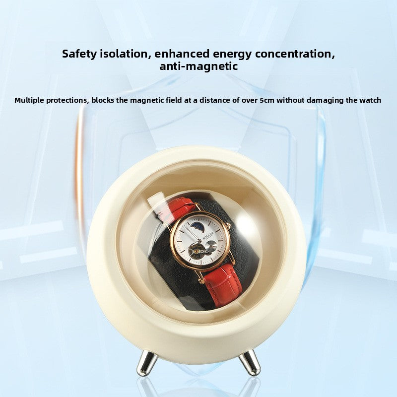 Cream single watch winder capsule on metal feet with a watch resting on the cushion behind the dome
