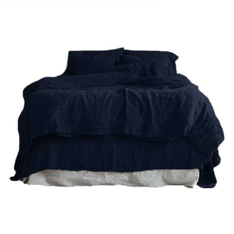Muted solid color cotton linen bedding set, duvet cover, sheet and pillowcases on a bed