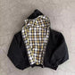 Black reversible zip hooded sweatshirt, solid black outer with a yellow tartan plaid reverse