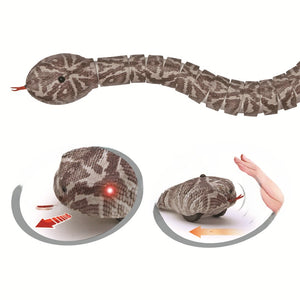 Remote control snake cat toy in a realistic scale pattern moving across the floor