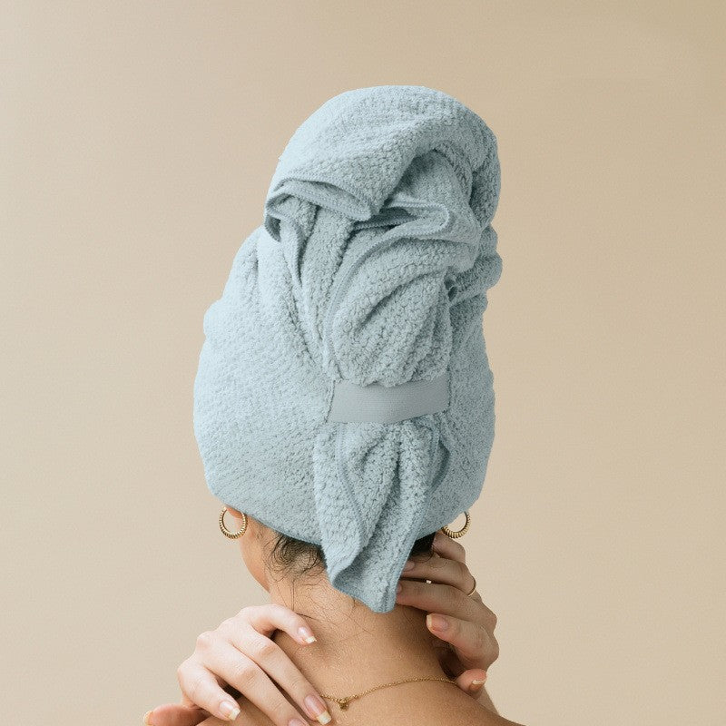 Light blue coral fleece hair drying towel wrapped on the head with an elastic strap, photo for the Light Blue option