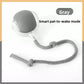 Grey silicone rolling cat ball with a knotted rope tail, labelled with the pat to wake mode