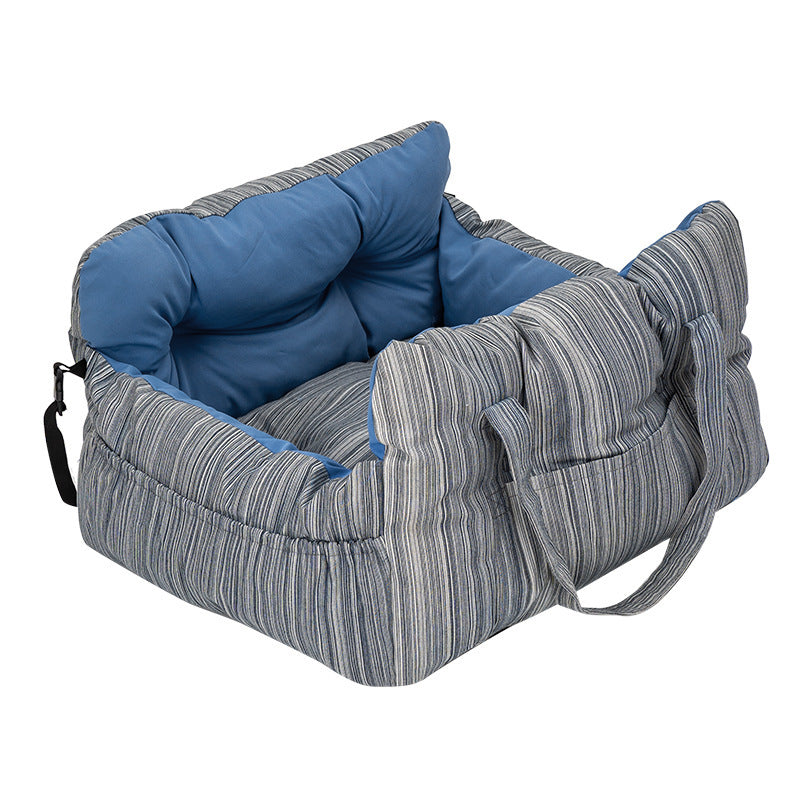 Padded car seat pet bed with raised bolster walls, carry handles and an inner clip in the olive canvas colourway