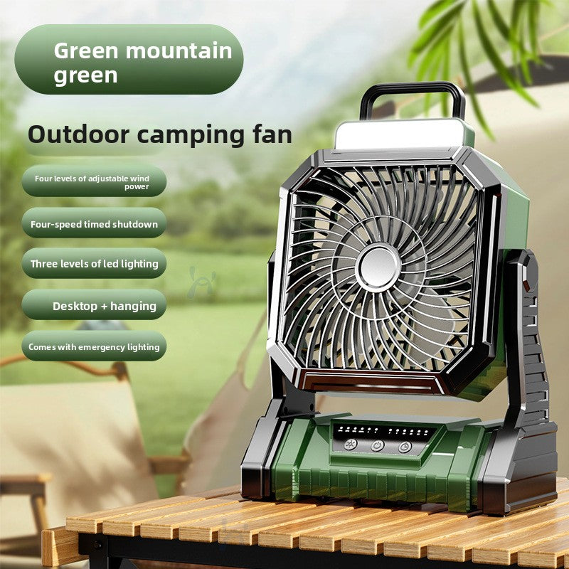 Green mountain outdoor camping fan on a wooden table with a feature list
