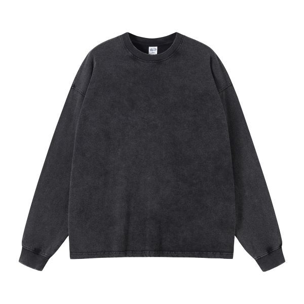 Cloudy mineral wash fade across the body of the orange long sleeve tee