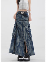 Marbled wash denim maxi skirt worn with a silver top, front view showing the A-line flare and center slit