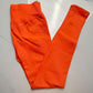 Coral red seamless leggings with the curved knitted seat panel visible on the flat lay